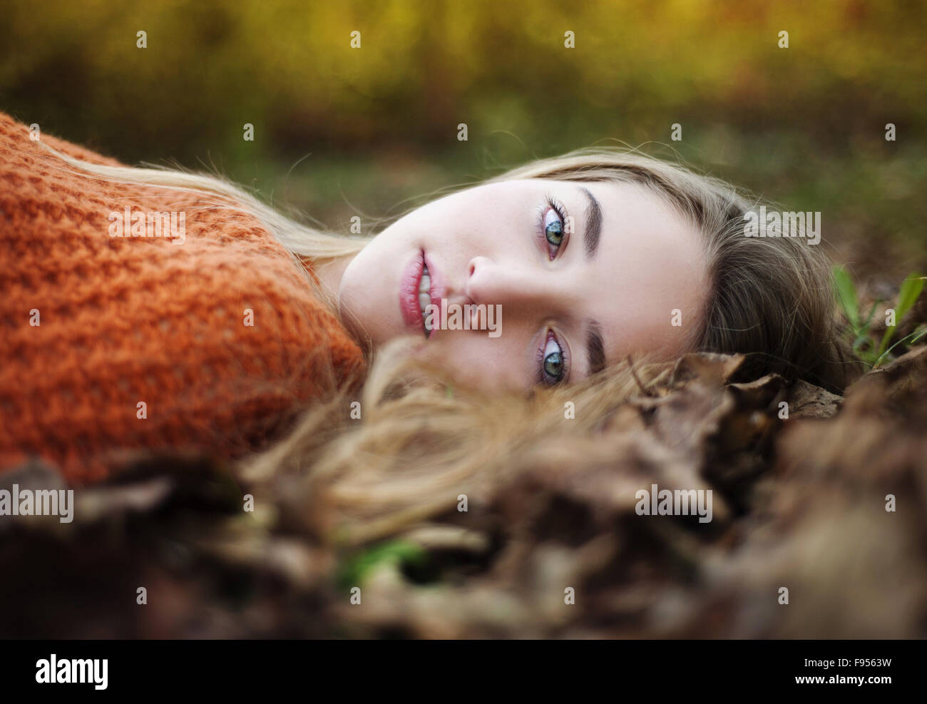 Outdoor portrait of beautiful girl in autumn forest Stock Photo - Alamy