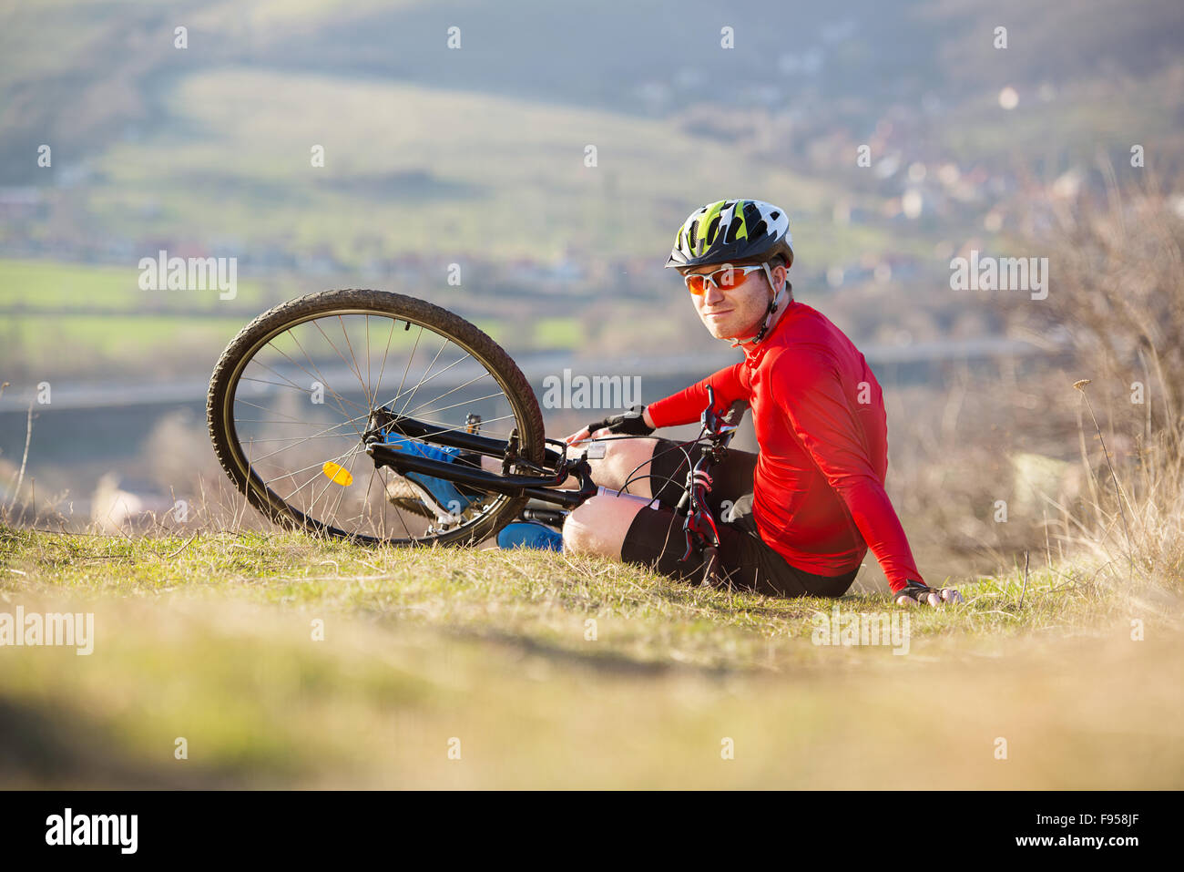 Young man injured during riding a bike Stock Photo