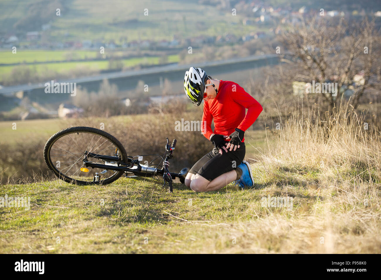 Young man injured during riding a bike Stock Photo