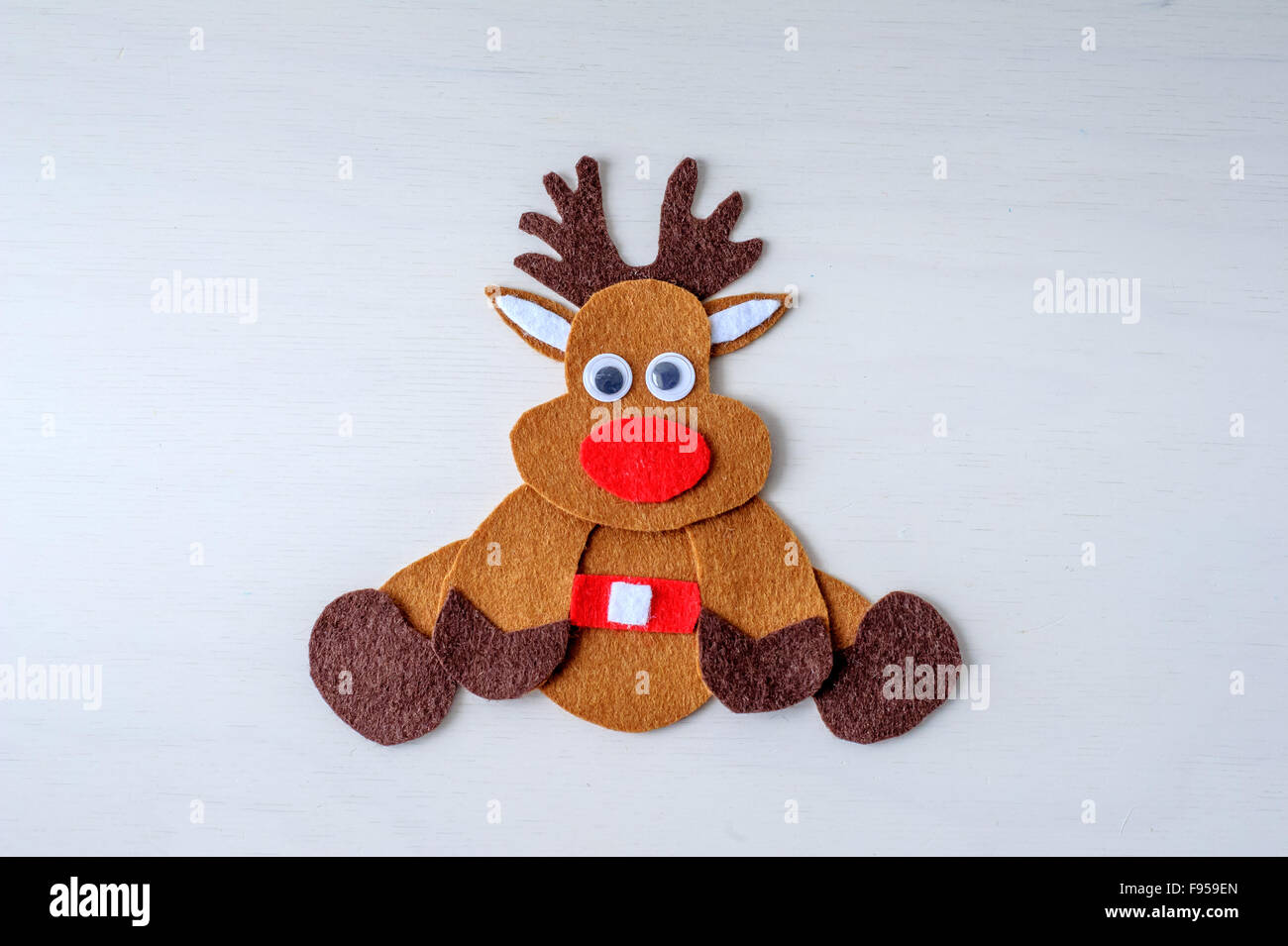 greeting card handmade christmas rudolph reindeer from felt in the winter time Stock Photo