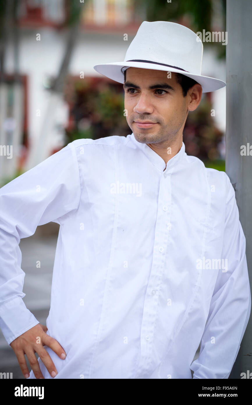 Hispanic man in white shirt and white hat Stock Photo