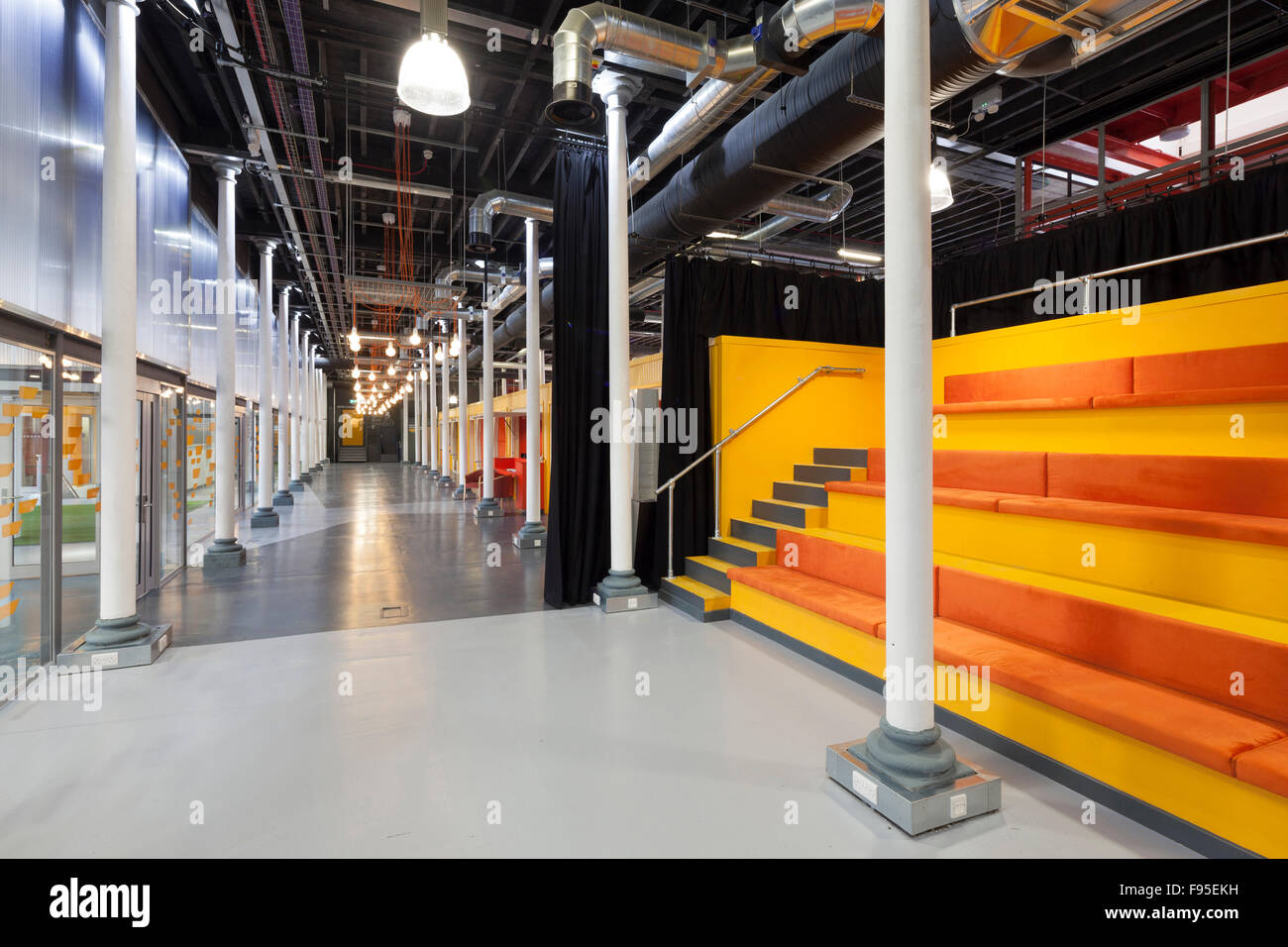 Engine Shed is a collaboration between Bristol City Council, the University of Bristol and the West of England Local Enterprise Partnership at the heart of Temple Quarter Enterprise Zone. View of a corridor in the Engine Shed. Bleacher-style seating area. Contemporary architecture and design. Stock Photo