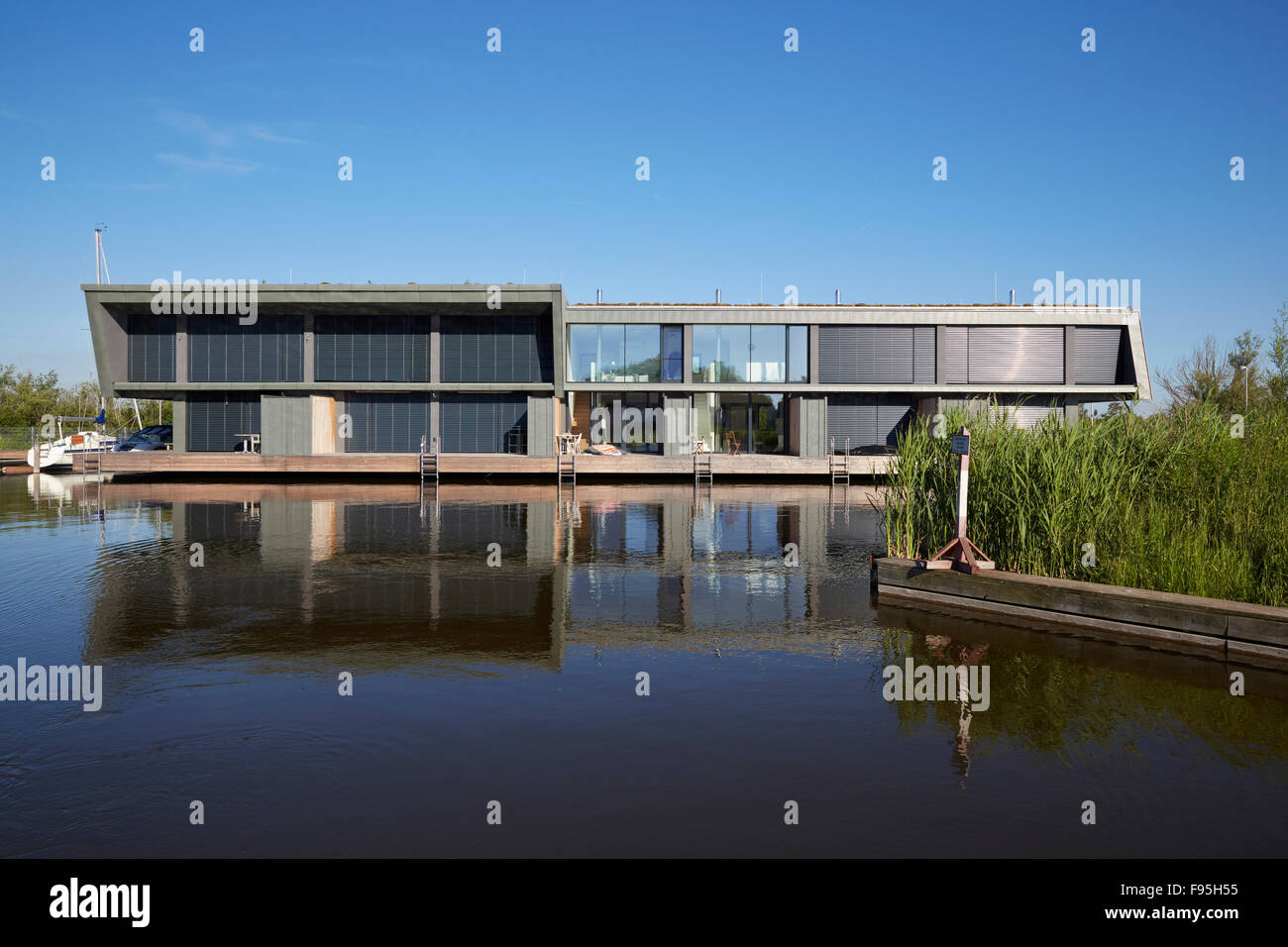Housing development at Lake Neusiedl, Neusiedl am See, Burgenland, Austria. Exterior view with waterside foliage of the contemporary lakeside housing development at Neusiedl am See, Burgenland, Austria Stock Photo