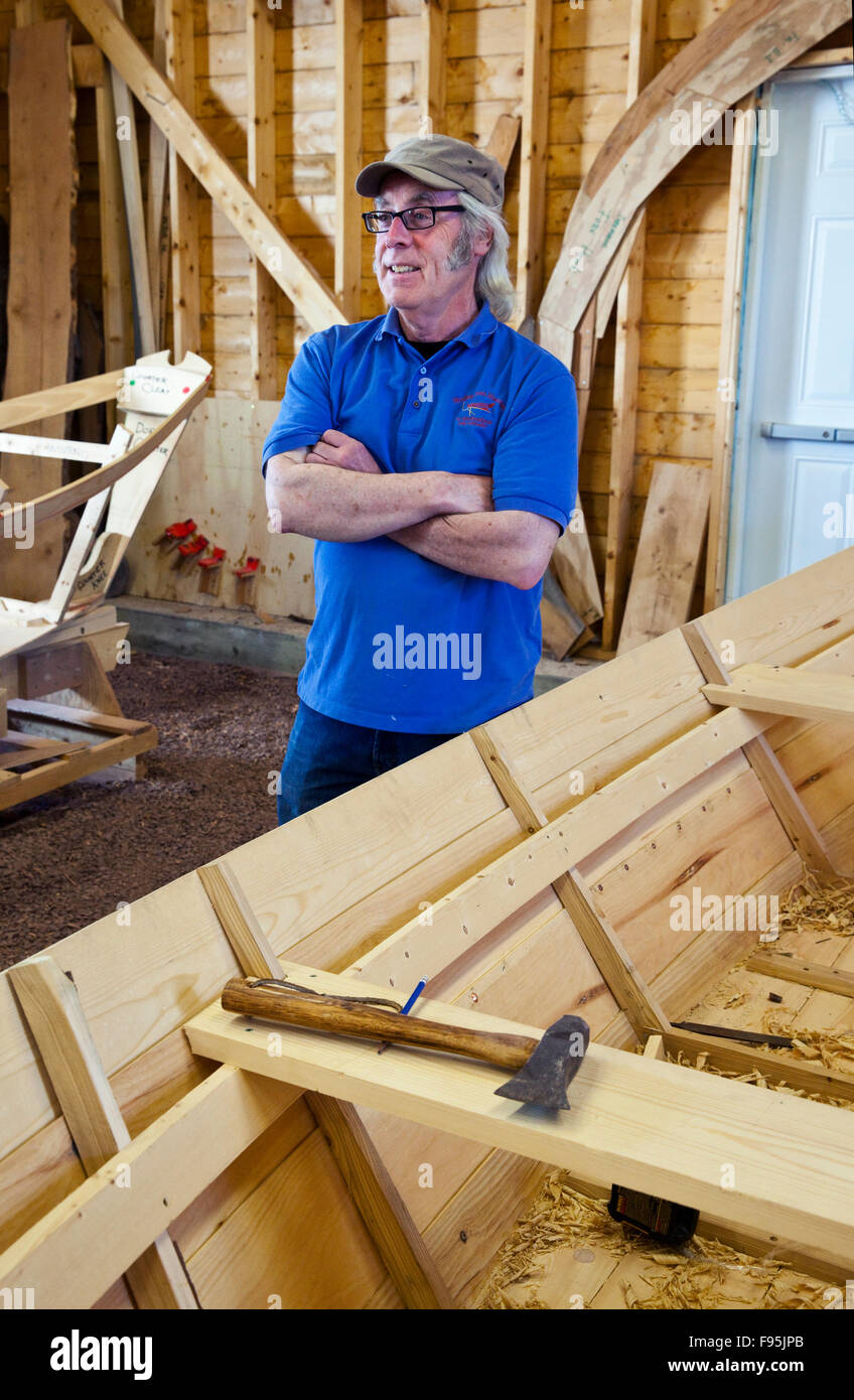 Master Boat Builder Jerome Canning in his boat shed at the Wooden Boat Museum of Newfoundland and Labrador, Winterton, Stock Photo