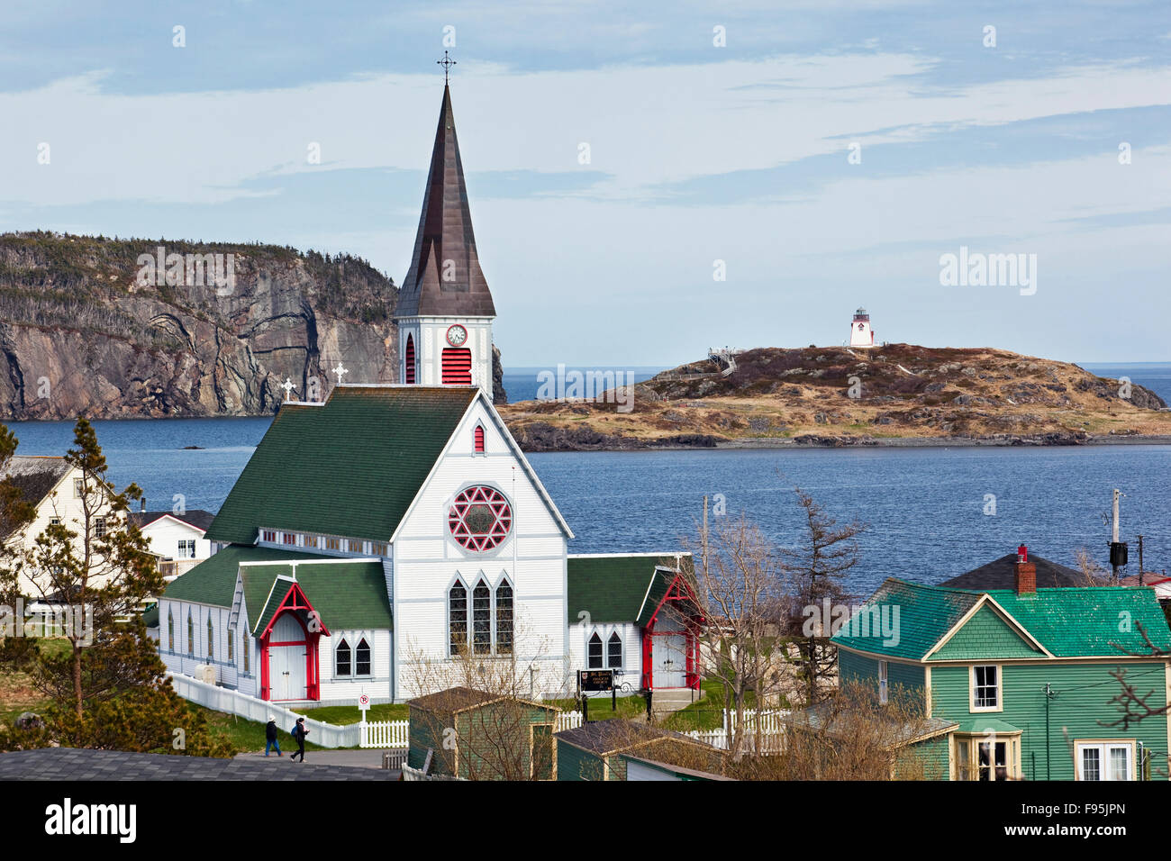 High angle view of St. Paul's Anglican Church in the foreground and Fort Point Lightouse in the background, Trinity, Stock Photo