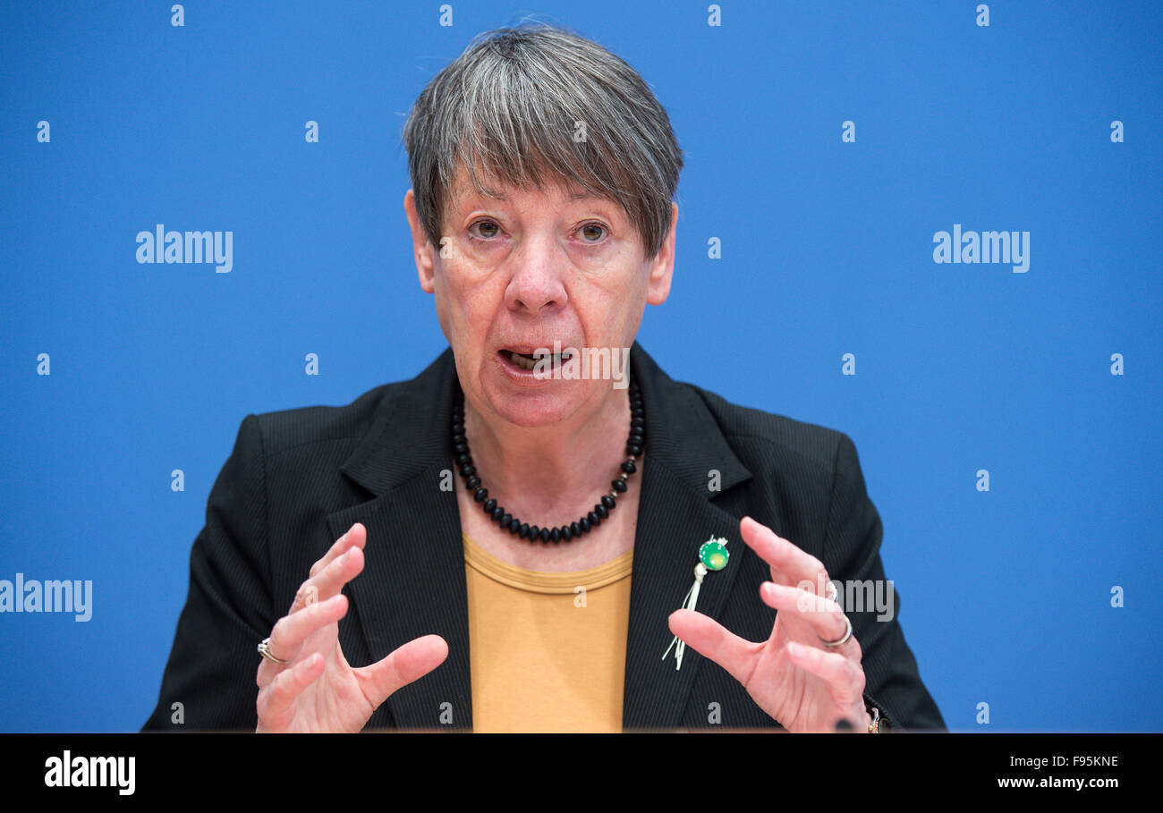 German Environmental Minister Barbara Hendricks speaks about the results of the UN Climate Change Conference in Paris at a press conference in Berlin, Germany, 14 December 2015. She wears a pin on her jacket - a good luck charm made of dried blades of grass - that was distributed in Paris by Tony Brum, Foreign Minister from the Marshall Islands, which will sink if ocean levels continue to rise. After two weeks of negotiations, almost every state in the world settled on a historic climate protection agreement, the main goal of which is to hold the global warming caused by greenhouse gases to we Stock Photo