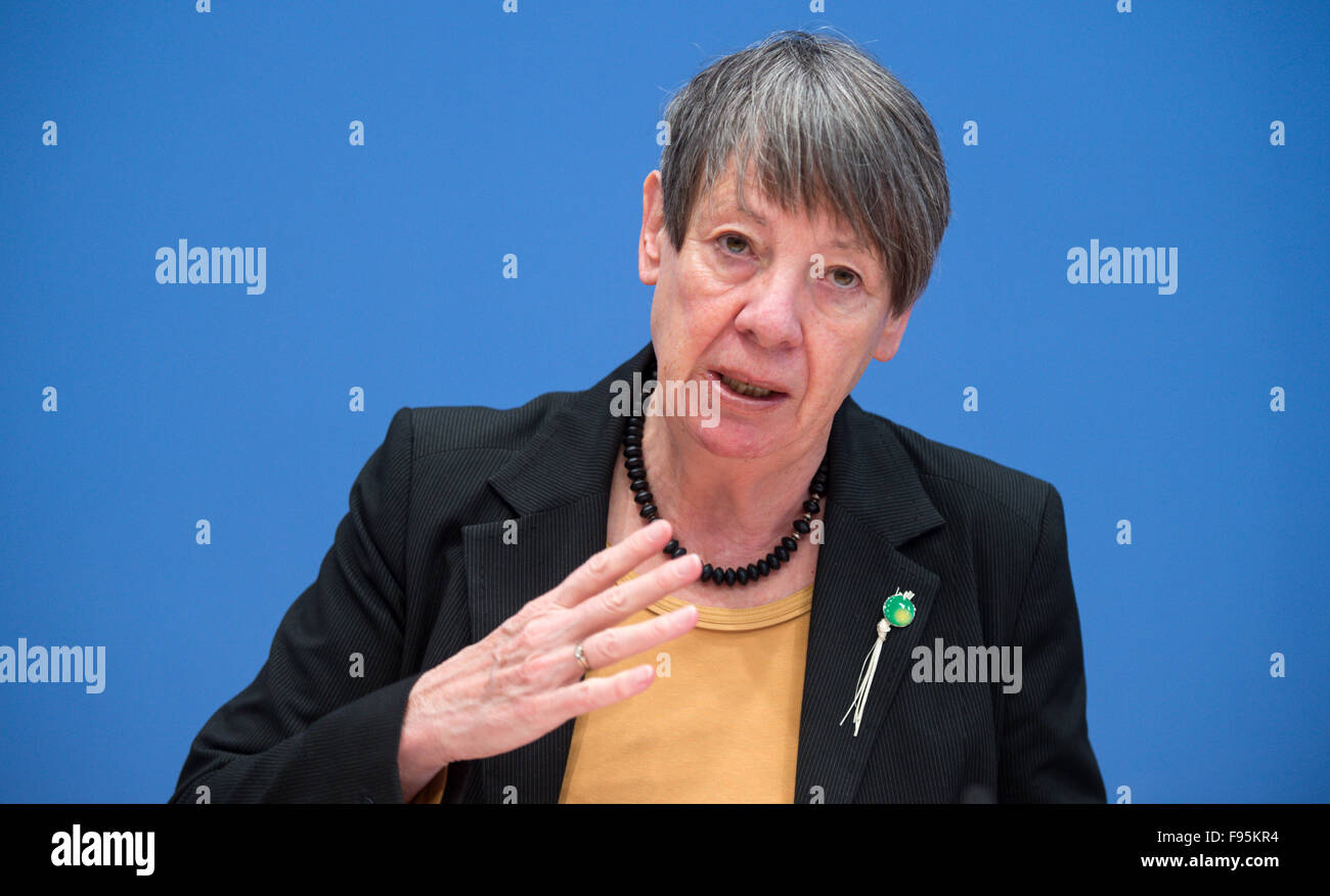 German Environmental Minister Barbara Hendricks speaks about the results of the UN Climate Change Conference in Paris at a press conference in Berlin, Germany, 14 December 2015. She wears a pin on her jacket - a good luck charm made of dried blades of grass - that was distributed in Paris by Tony Brum, Foreign Minister from the Marshall Islands, which will sink if ocean levels continue to rise. After two weeks of negotiations, almost every state in the world settled on a historic climate protection agreement, the main goal of which is to hold the global warming caused by greenhouse gases to we Stock Photo