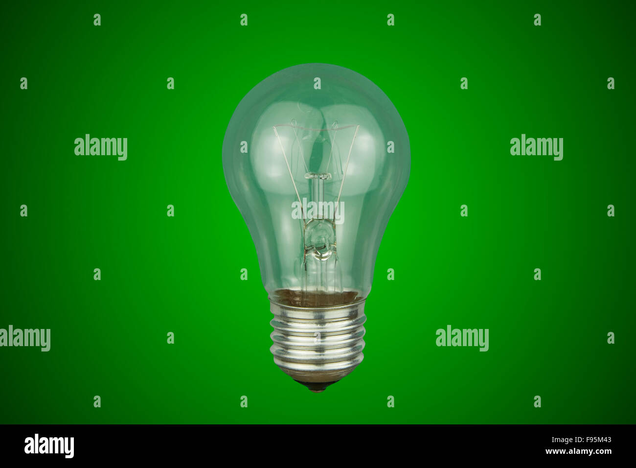 light bulb on a green background Stock Photo - Alamy