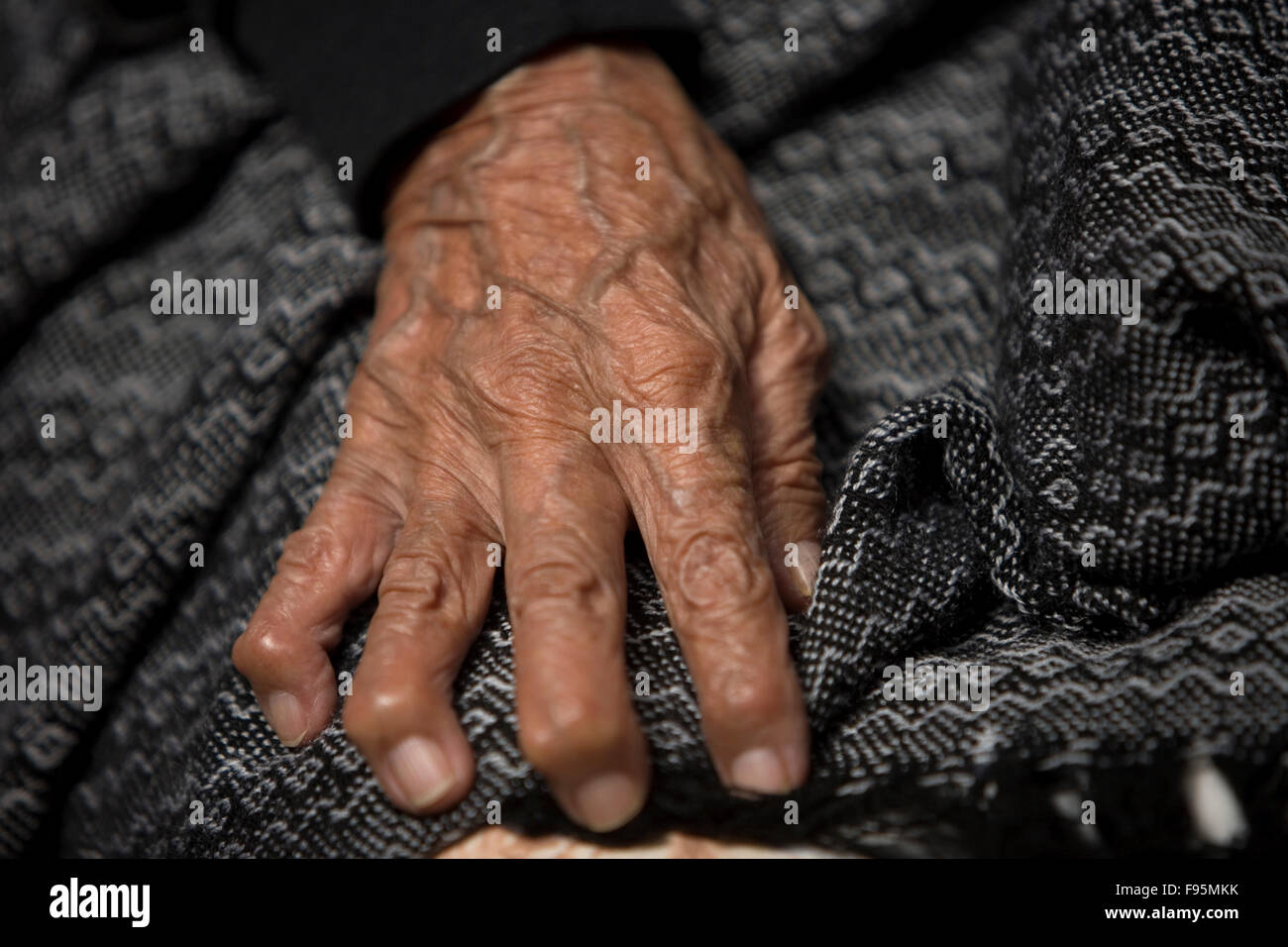 The hand of an elderly woman in the Our Lady of Guadalupe Home for the Elderly, Mexico City Stock Photo