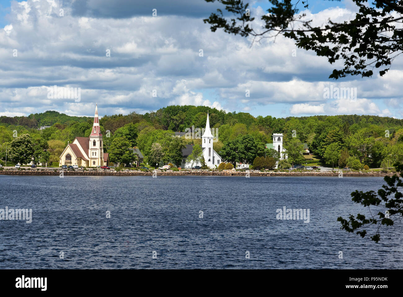 Three churches side by side in Mahone Bay, Nova Scotia: St. James' Anglican, St. John's Evangelical Lutheran, and Trinity Stock Photo