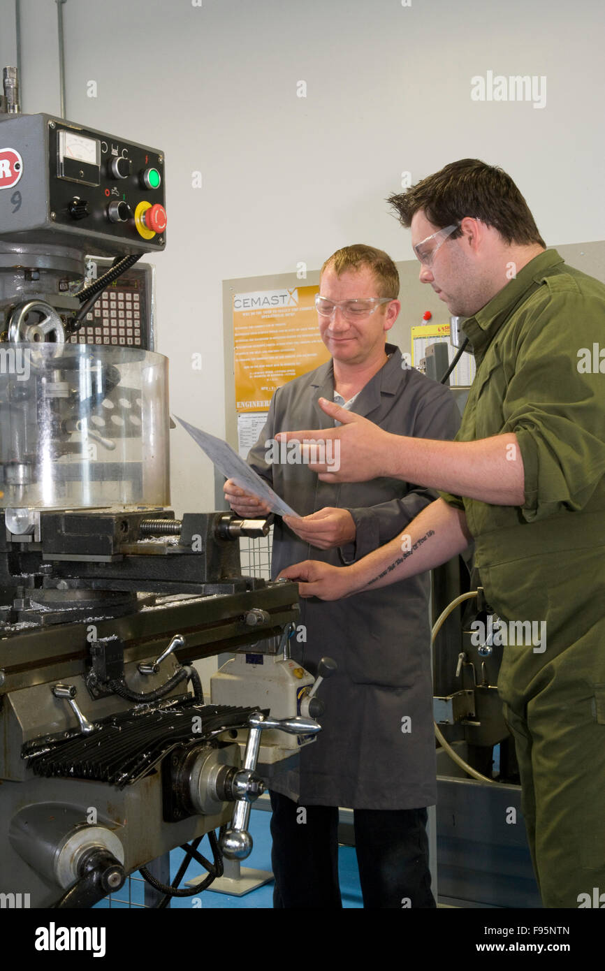 Machine Shop Apprentice Apprentice operates milling machine / drill Stock Photo - Alamy