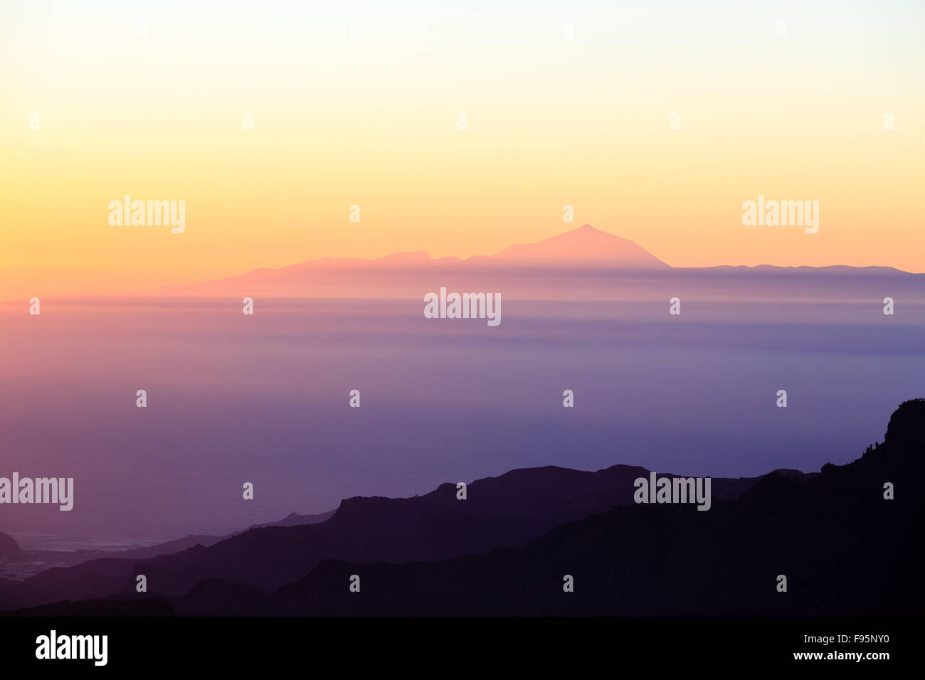 Mountains inspirational sunset landscape with Pico del Teide, islands and ocean, Canary Islands.  Looking from Gran Canaria at T Stock Photo