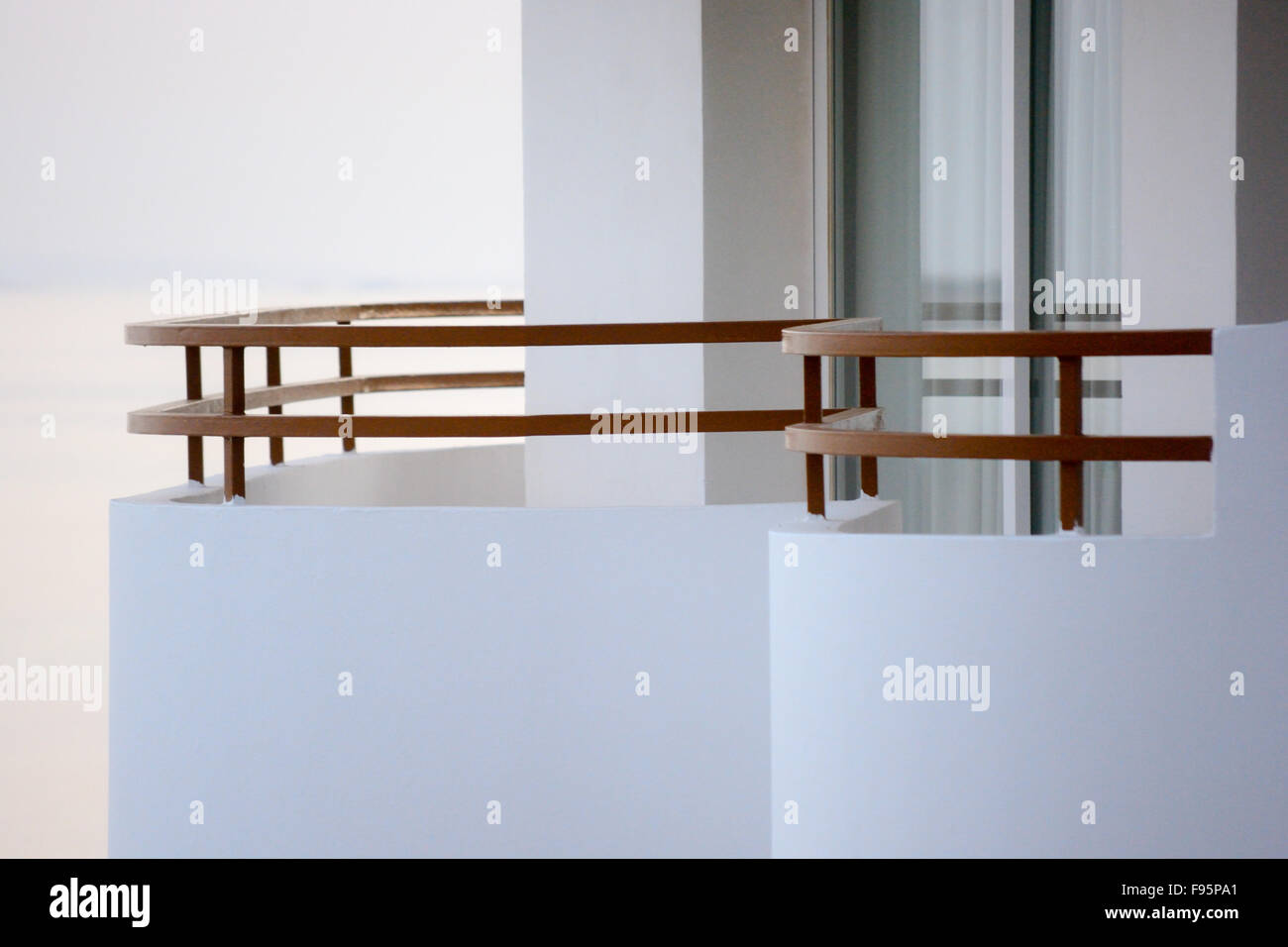 Hotel room balcony with curved wall and safety rail Stock Photo Alamy