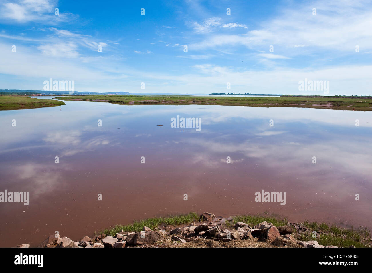 View of mudflats after they are inundated by the rising tide at the Wolfville Waterfront Park. The town is located on the shore Stock Photo