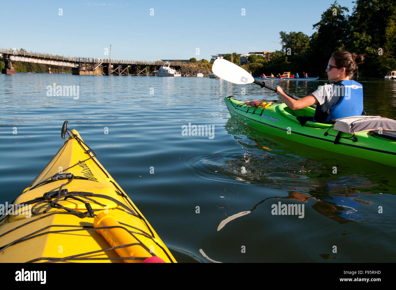 View from a kayak as we paddle the Inner Harbour of Victoria, BC, on a summer afternoon. Stock Photo