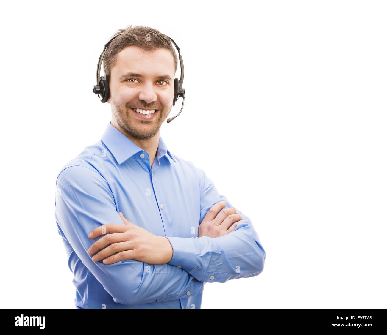 Call center operator isolated on white. Young handsome man with headset. Stock Photo