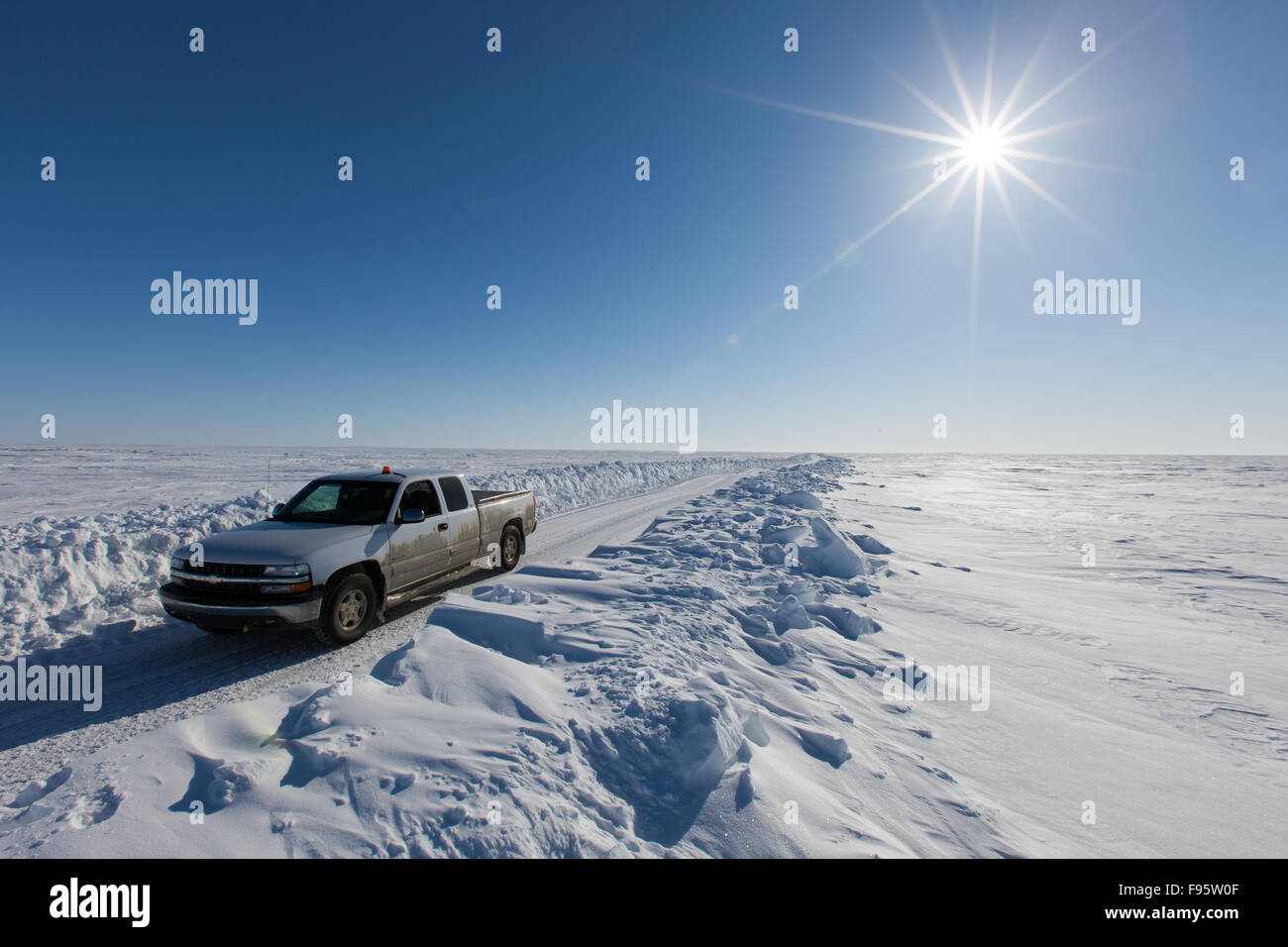 A truck on an ice road on the Arctic Ocean, near Cambridge Bay, Nunavut, Canada. Stock Photo