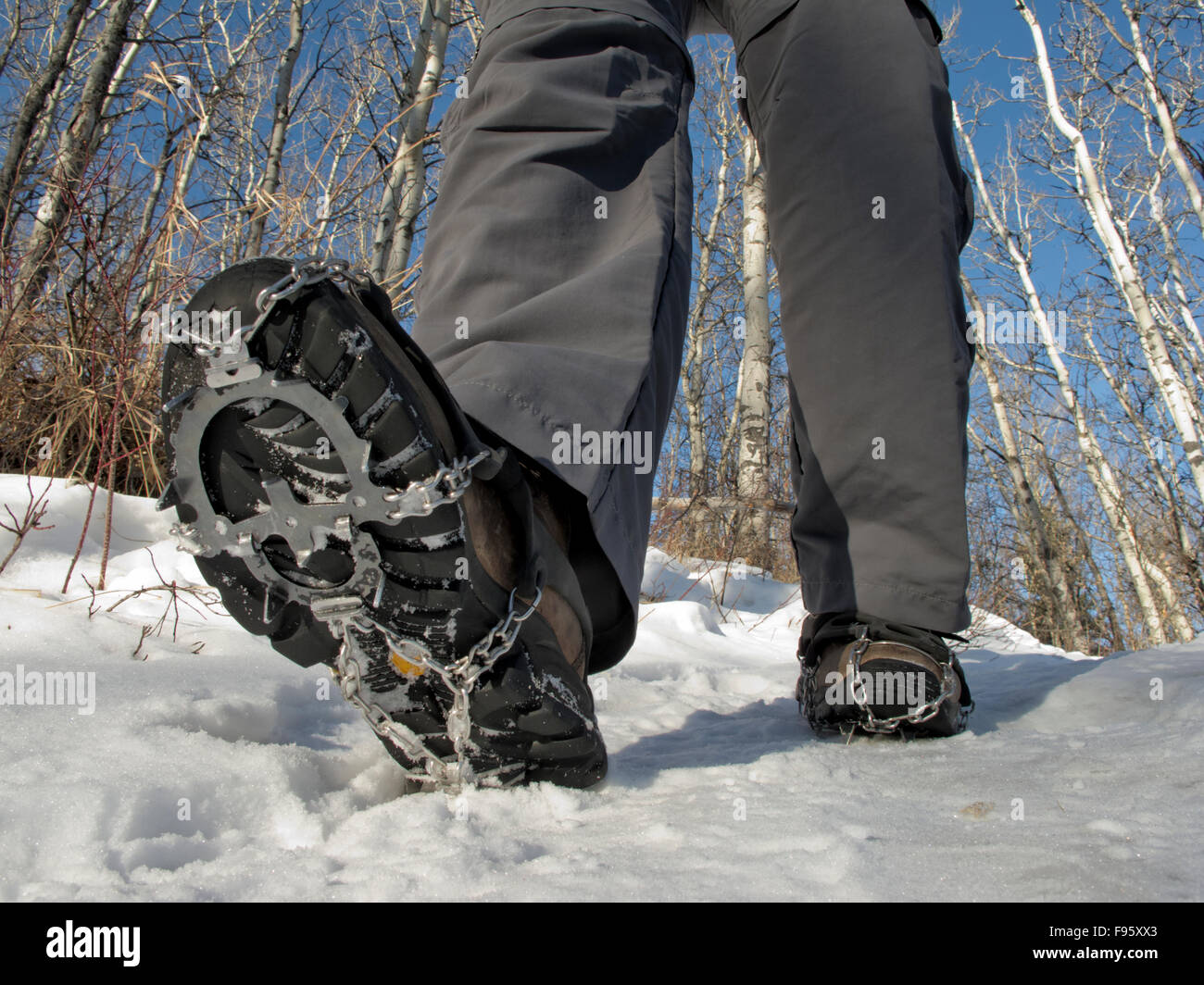 Walking with snow cleats in winter Stock Photo Alamy