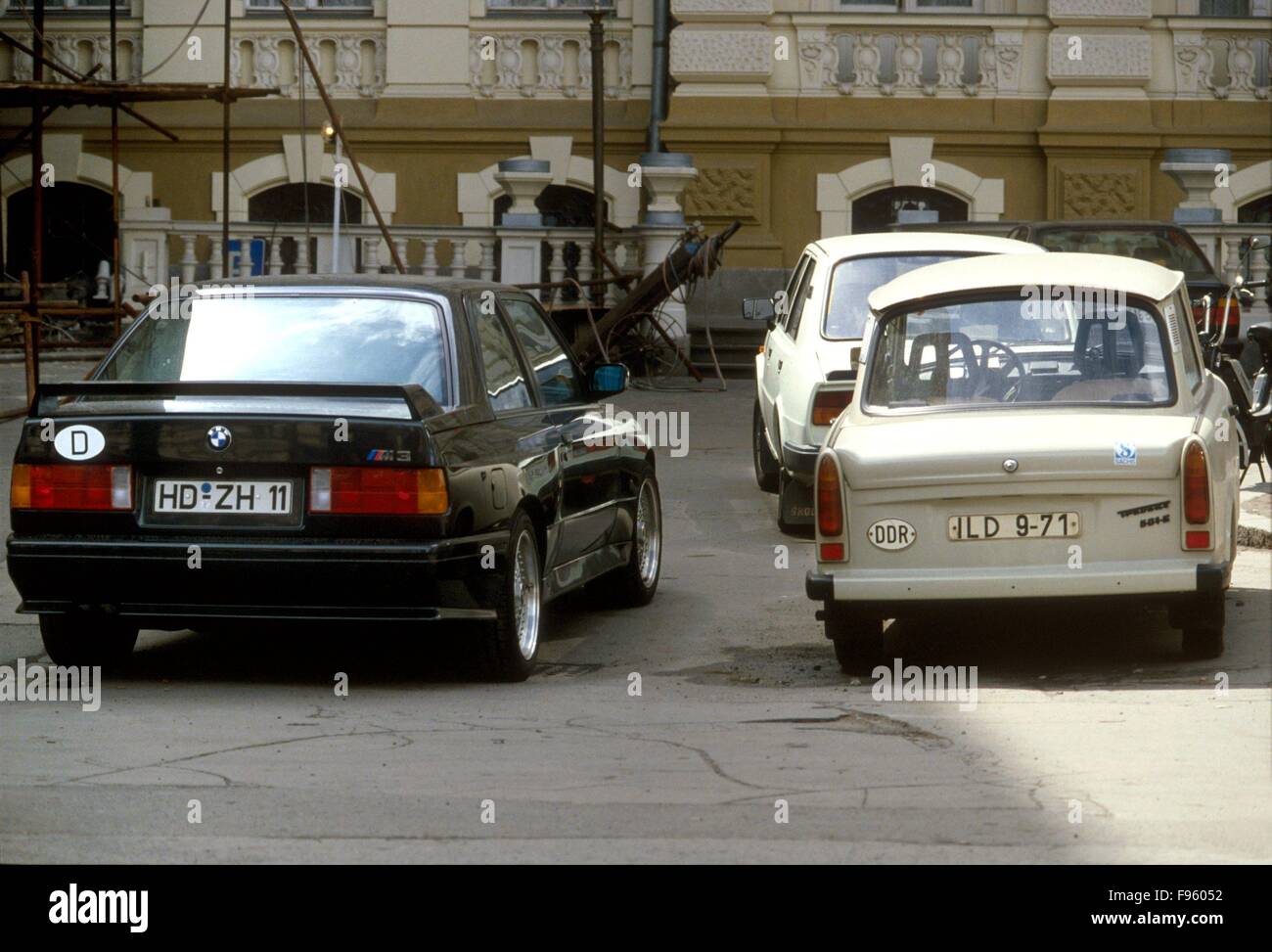 Karlovy Vary (Czech Republic, 1988) - a BMW car of Federal Republic of Germany (BRD) parked near a Trabant of German Democratic Republic (DDR)     - automobile BMW della Repubblica Federale Tedesca (RFT ) parcheggiata a fianco di una Trabant  della Repubblica Democratica Tedesca (DDR) Stock Photo