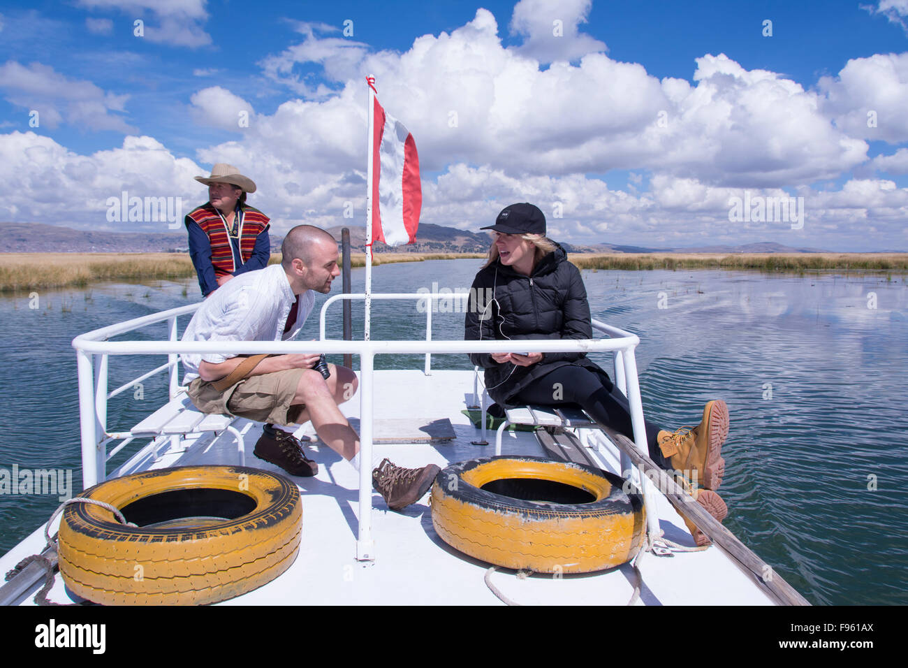 Visitors aboard tour boat, Lake Titicaca, Peru Stock Photo
