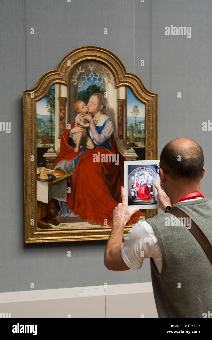 Visitor with tablet camera at Gemäldegalerie art museum in Berlin, Germany Stock Photo
