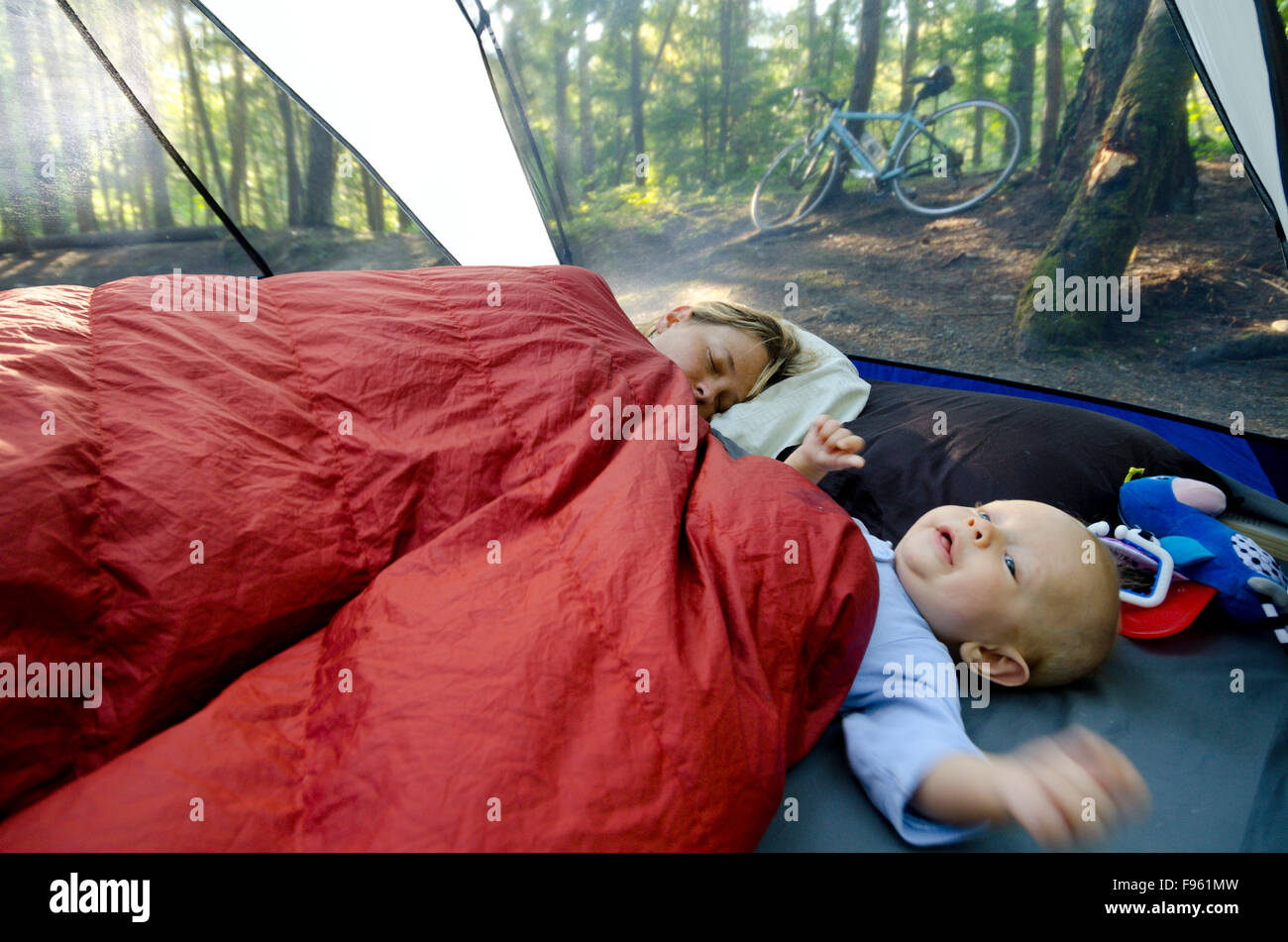 A Young Mother And Her One Year Old Boy In A Tent On A Camping Trip Mom Is Still Trying To Sleep Rosebery Provincial Park Stock Photo Alamy