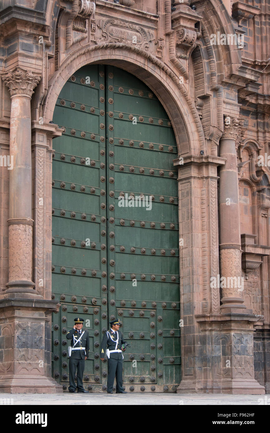 Policemen in front of Cusco Cathedral doorway, Cuzco, Peru Stock Photo