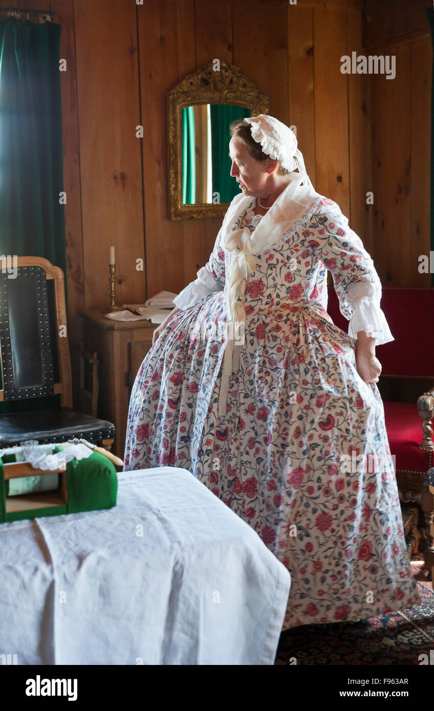 In this reenactment of daily life at Fortress of Louisbourg in the 18th Century, a woman is portaying the wife of Captain De Stock Photo