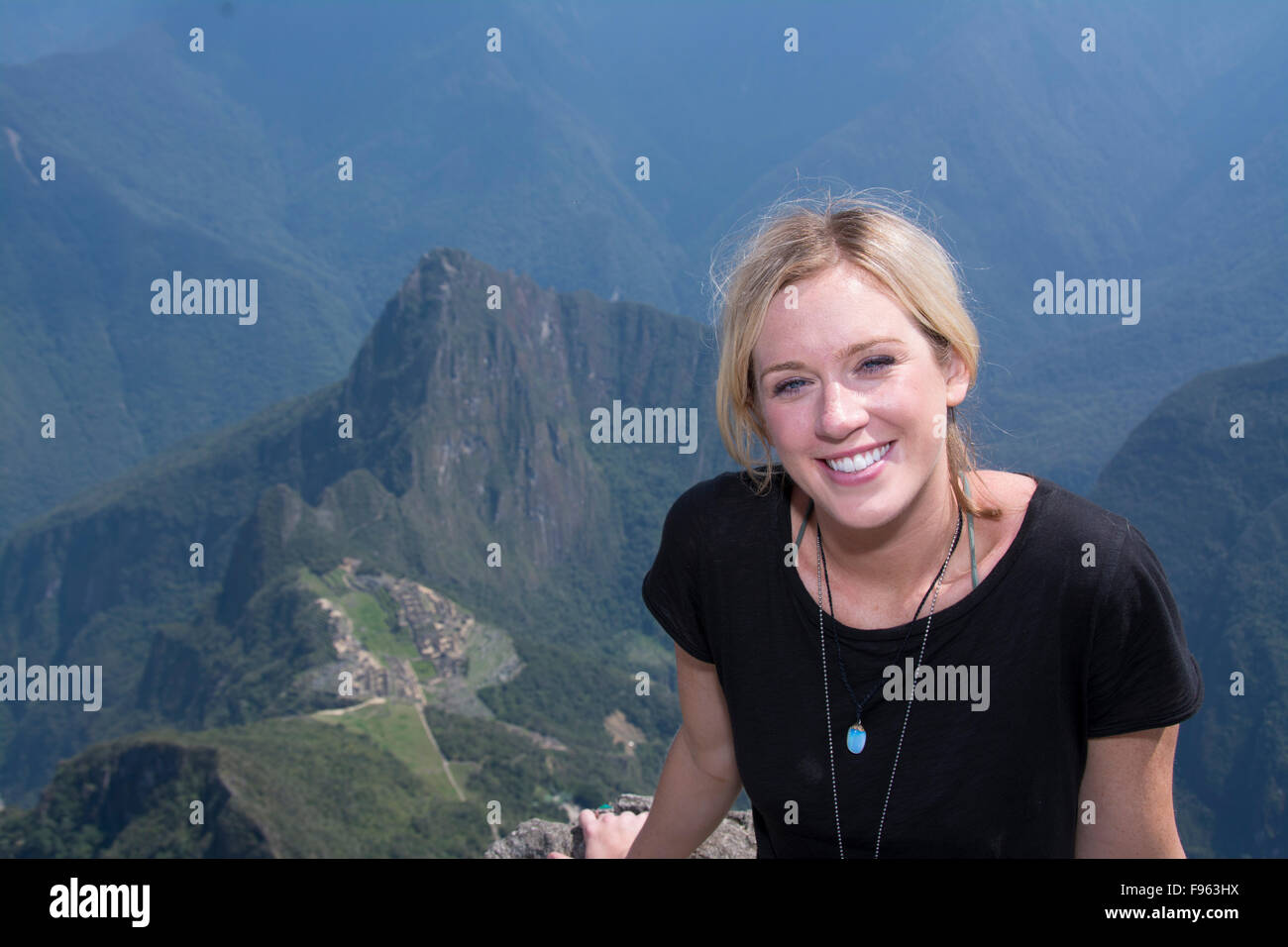 Travellers at the high vantage point of Montana Machu Picchu, Peru Stock Photo