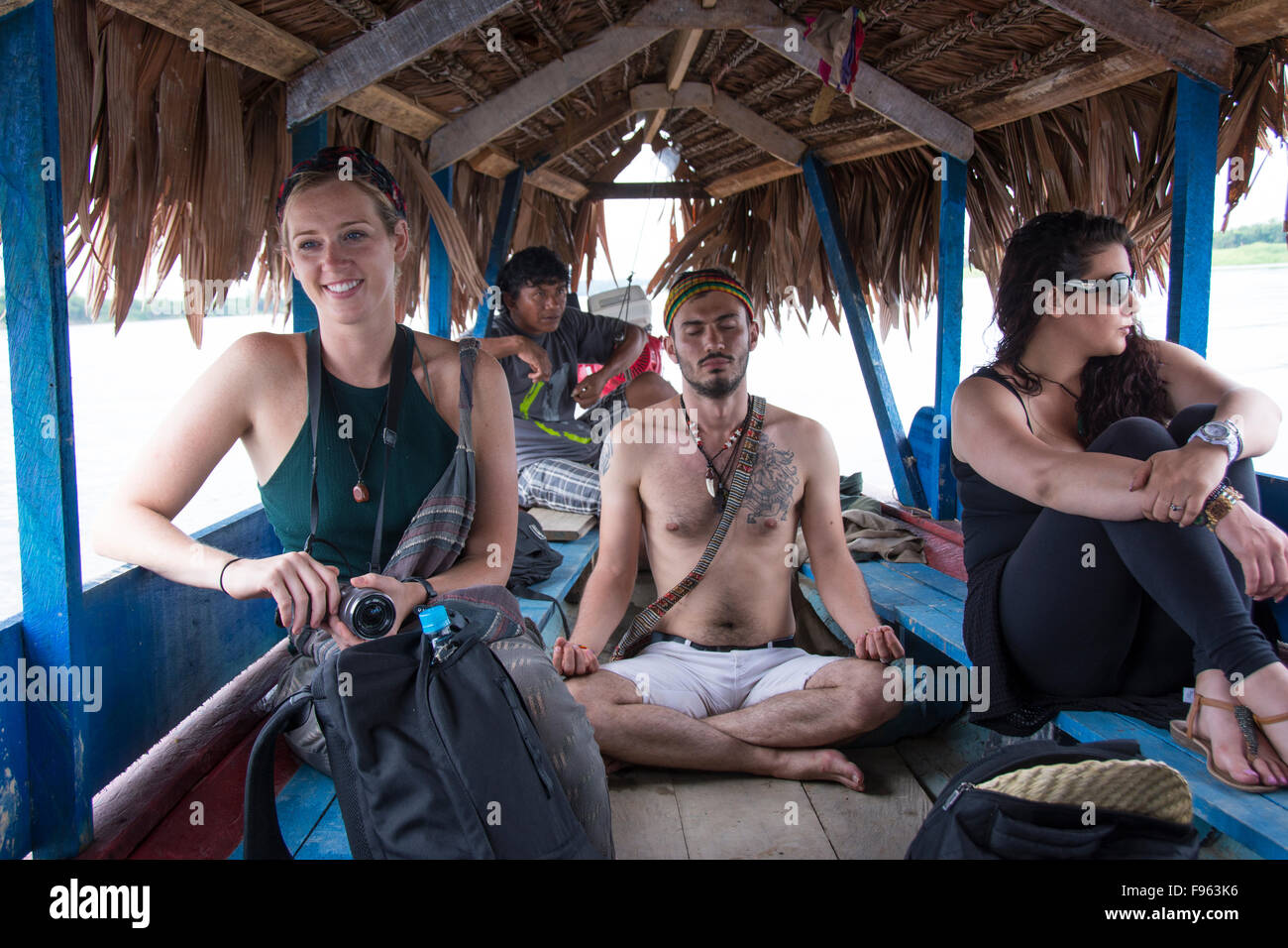 Travellers heading up the Amazon from Iquitos, the largest city in the Peruvian rainforest and the fifthlargest city of Peru Stock Photo