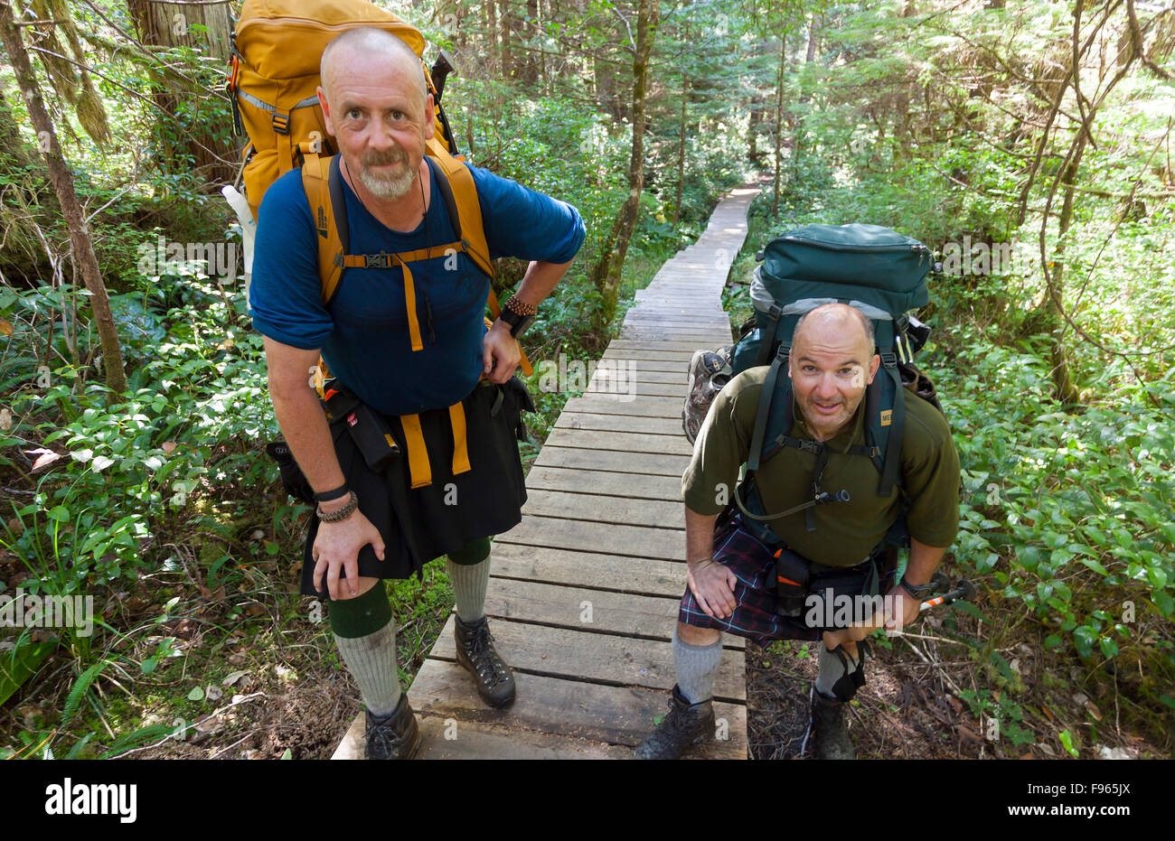 Two mature men hike along one of the many boardwalk sections of the North Coast Trail near San Josef Bay. Stock Photo