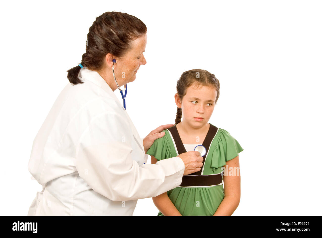 Female Doctor listening to stethoscope on chest of girl Stock Photo Alamy