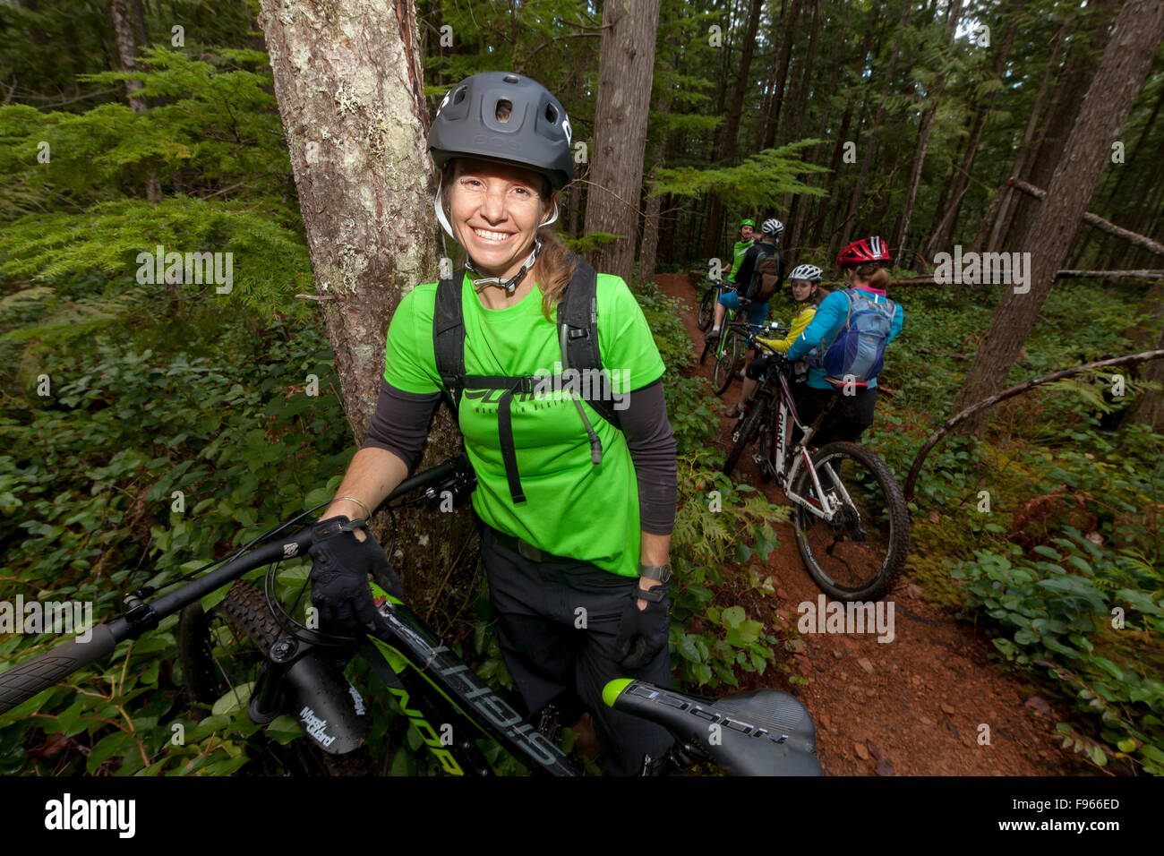 A group of women stop for a break while riding one of the popular 'lower' mountain bike trails near Cumberland.  Cumberland, Stock Photo
