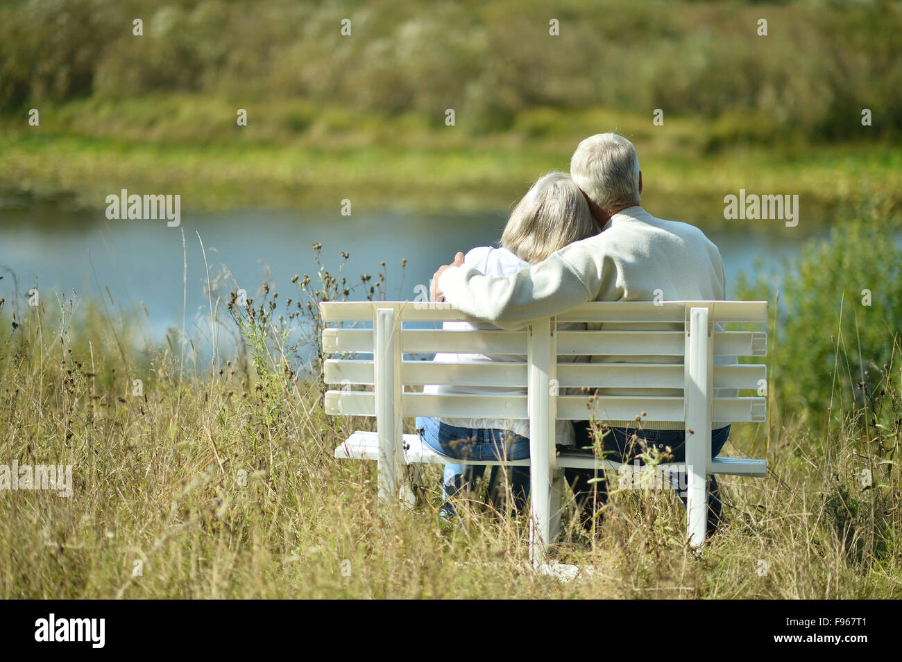 Elderly couple hugging lake hi-res stock photography and images - Alamy