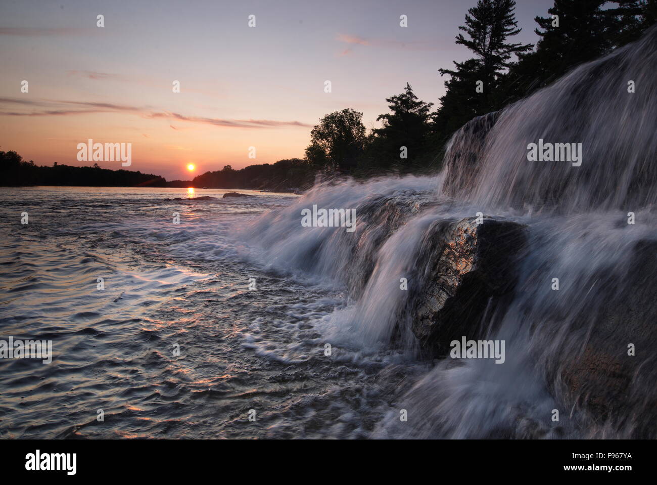 Bala Falls at sunset, Moon River, Muskoka, Ontario, Canada Stock Photo
