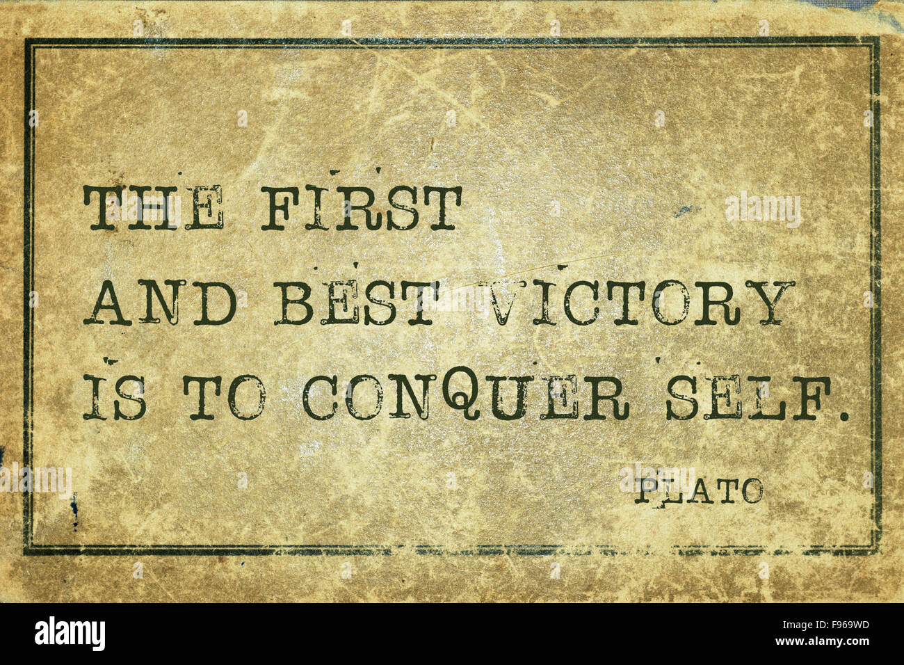 The first and best victory is to conquer self - ancient Greek philosopher Plato quote printed on grunge vintage cardboard Stock Photo