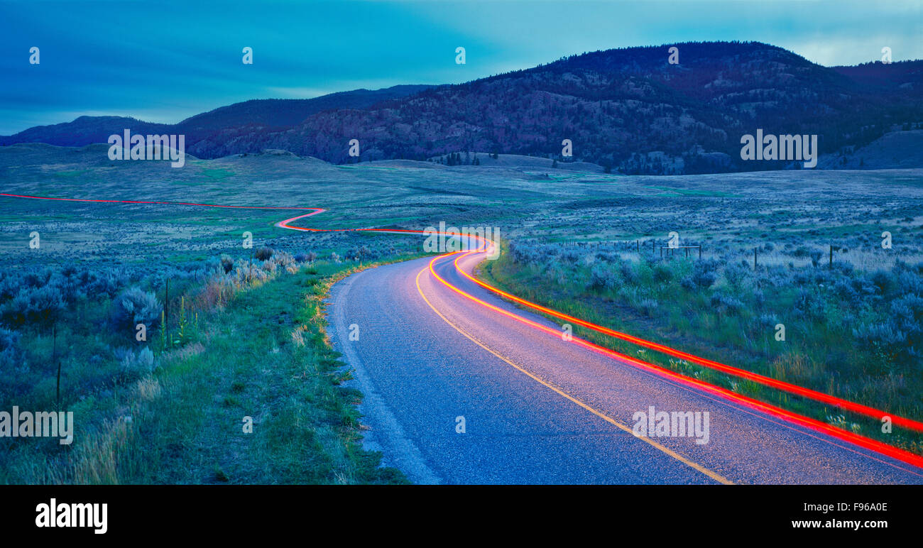 Light trail on a winding road in the Okanagan, British Columbia, Canada Stock Photo