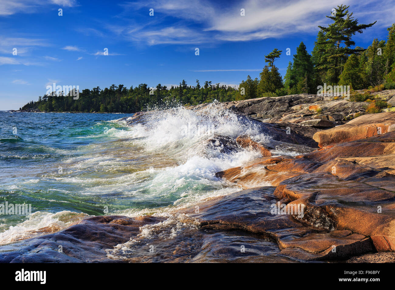 Waves crashing on rocks on Lake Superior at Catherine Cove, Lake Superior Provincial Park, Ontario, Canada Stock Photo