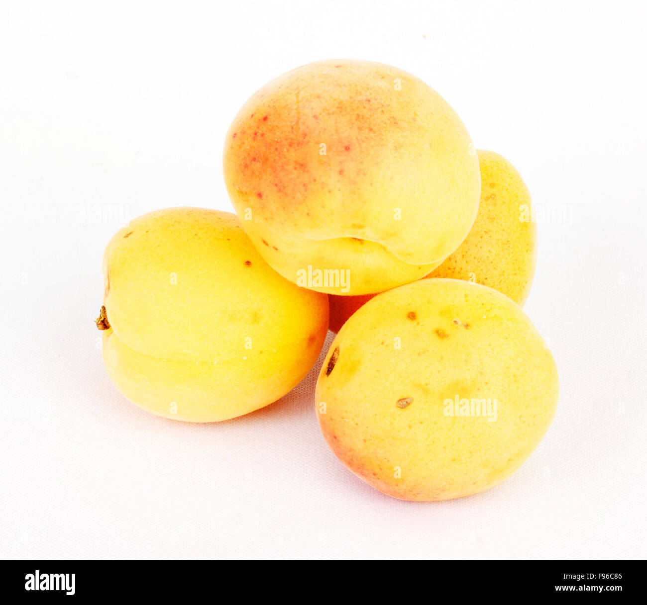 Apricots on a white background isolated Stock Photo - Alamy