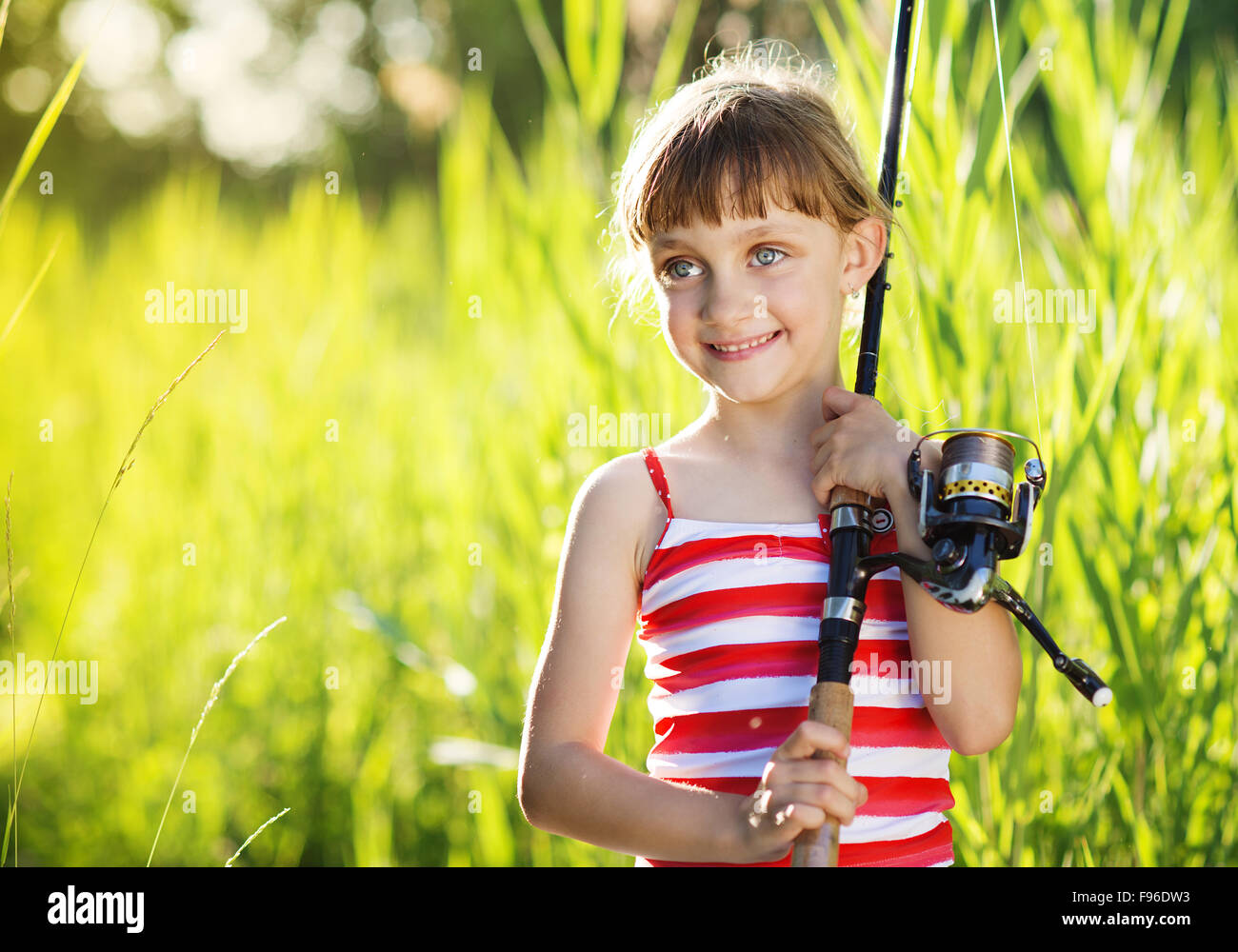 Cute little girl is ready to go fishing Stock Photo Alamy