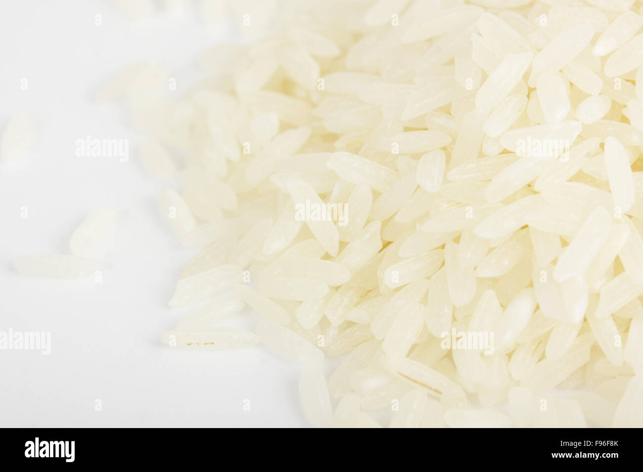 Pile of organic rice (on white Stock Photo - Alamy