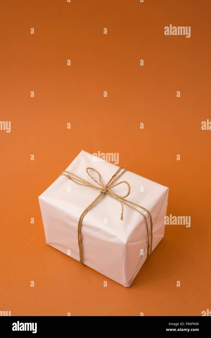 Simple gift box concept template on empty background with copy space. Ideal for sale or campaign. Stock Photo