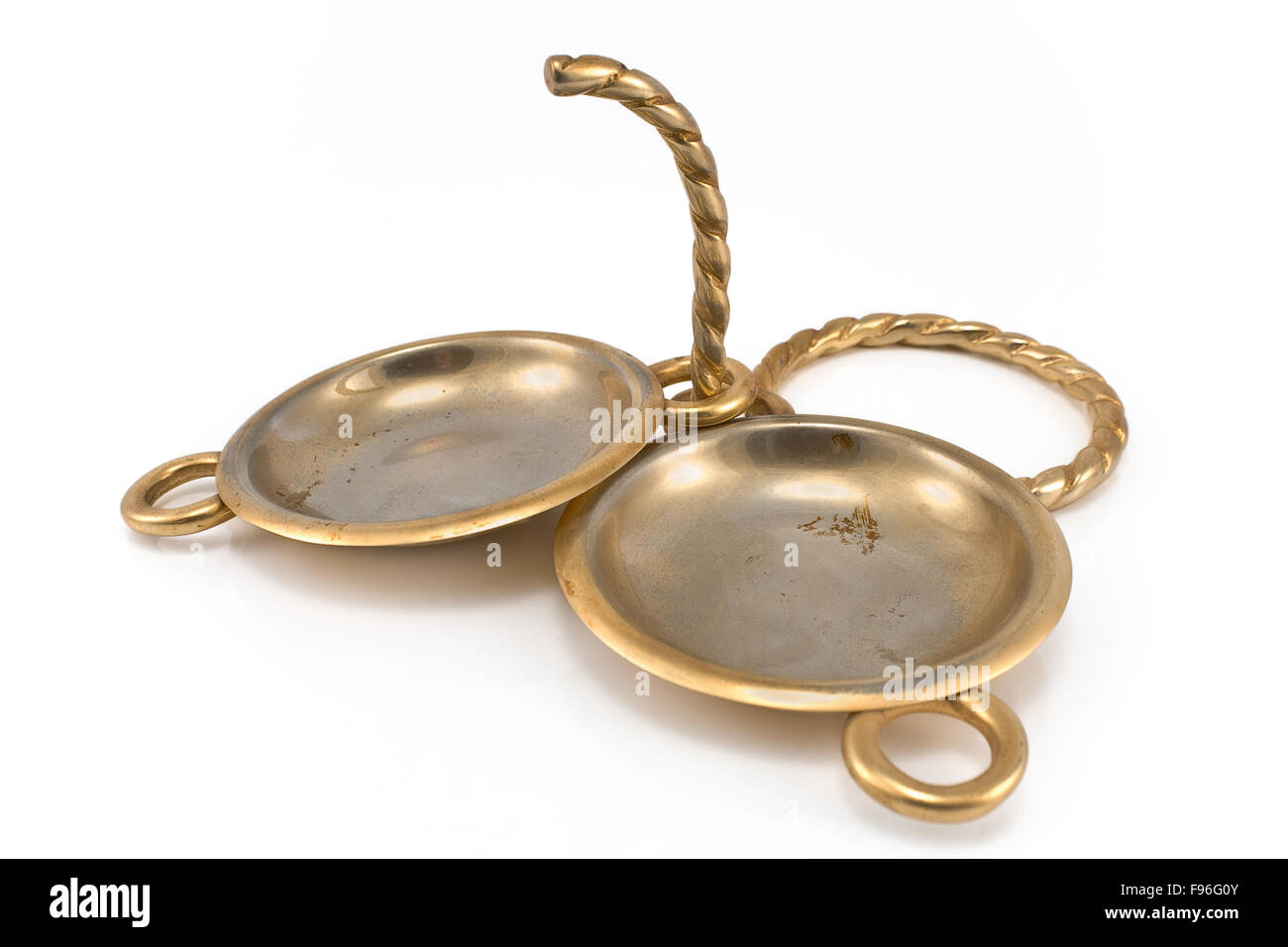 Two antique brass ashtrays isolated on white Stock Photo