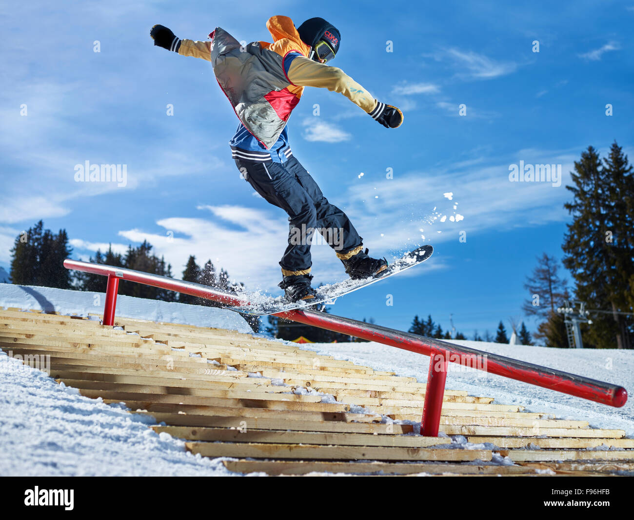 Teenage snowboarder grinding a pole in a funpark, Muttereralmpark, Mutters, Tyrol, Austria Stock Photo