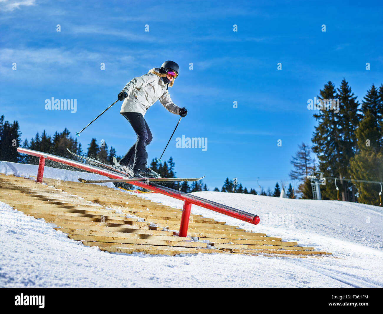 Teenage skier with twin-tips, sliding on a rail, Muttereralmpark, Mutters, Tyrol, Austria Stock Photo