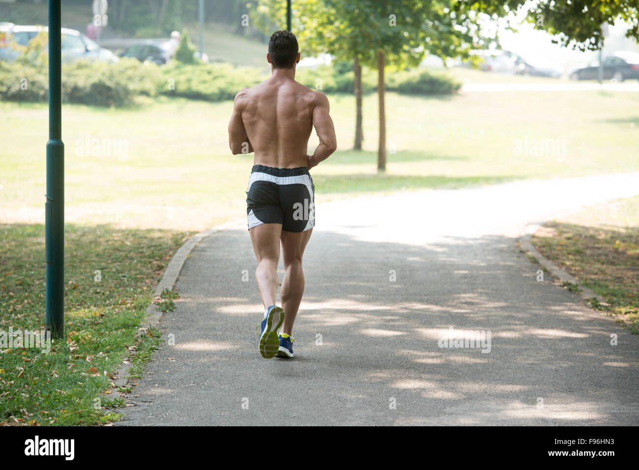 Young Bodybuilder Running In Park Area - Training And Exercising For Trail Run  Marathon Endurance - Fitness Healthy Lifestyle Co Stock Photo - Alamy