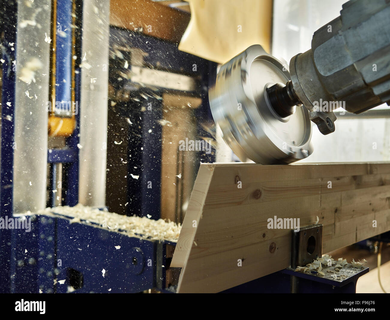 Wood milling machine shaping a wooden board, Austria Stock Photo - Alamy