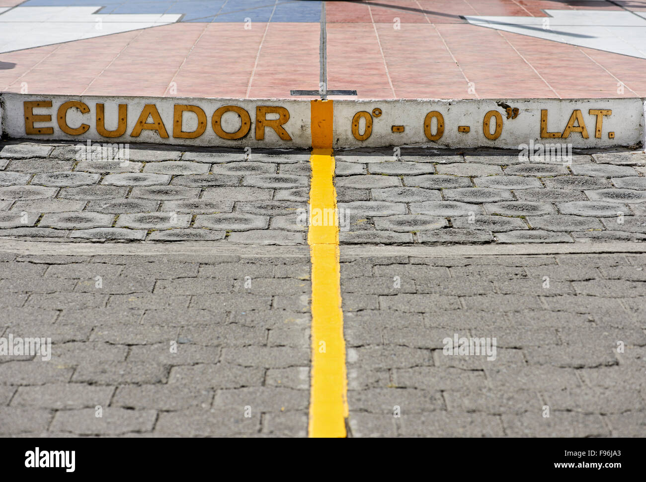 Yellow equator line, marking zero degrees latitude, Equator Monument La Mitad del Mundo, center of the world Stock Photo