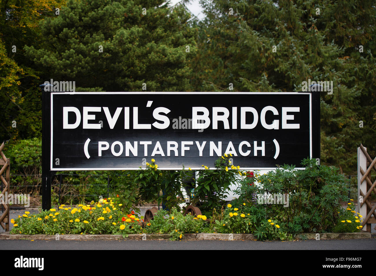 The sign for the station at Devil's Bridge (Pontarfynach)  at the terminus of the narrow gauge railway from Aberystwyth , Ceredugion Wales UK Stock Photo