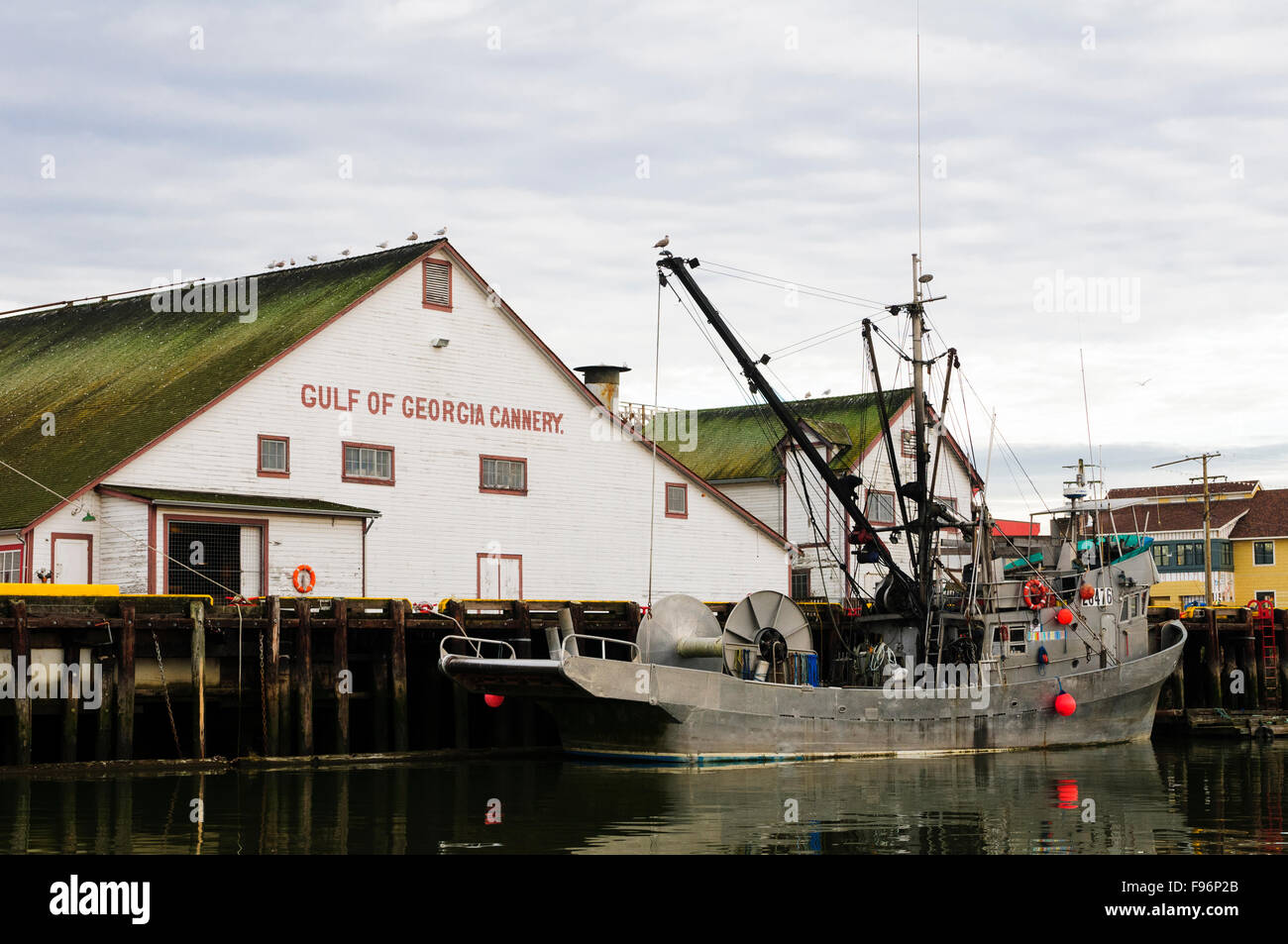 The fishing trawler, Cape Stephen, moored in front of the Gulf of Georgia Cannery in Steveston, British Columbia. Stock Photo